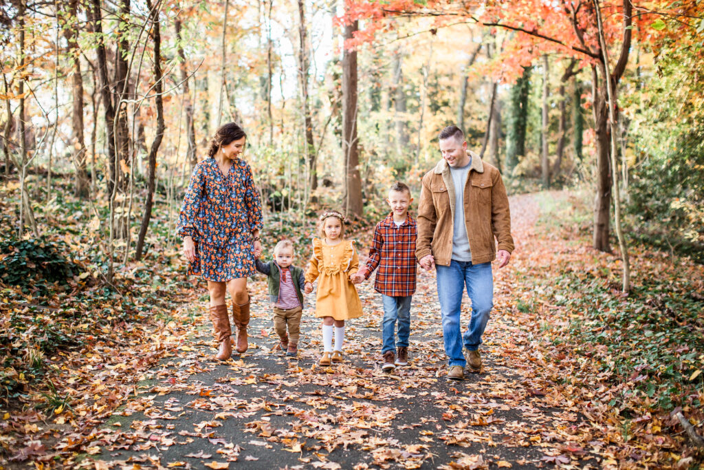 Family of five walking down the George Washington Parkway in the fall