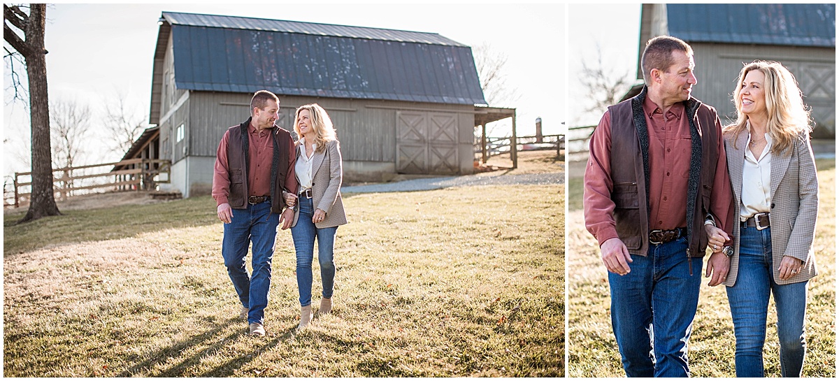 mom and dad in front of barn walking across grass during their winter family photo session