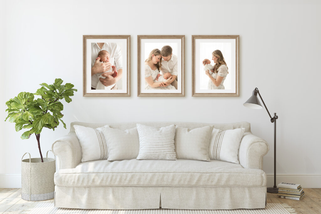 Three framed photos on the wall over a couch.