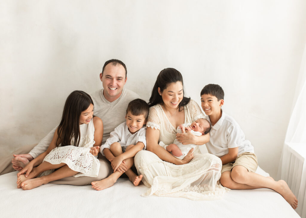 Family of six with newborn baby